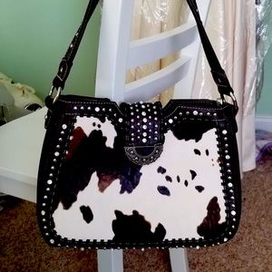 Cow print leather purse, concealed weapon safe